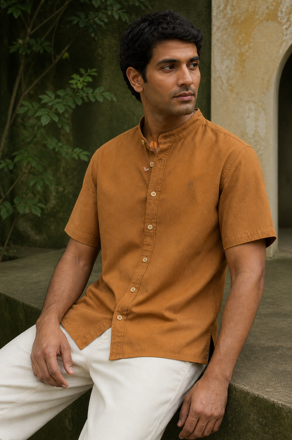 Man seated in the camel-brown Valuto Royale Regent Overshirt